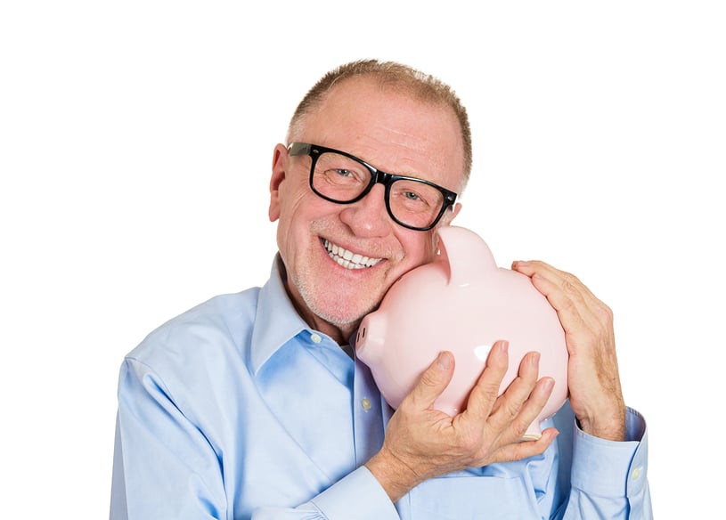 Closeup portrait, senior mature, happy, successful, enthusiastic affectionate sensitive nerd man in black glasses hugging piggy bank, isolated white background. Financial decisions, money saving, fund